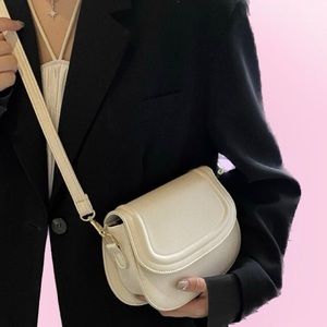 flap saddle crossbody bag in beige cream